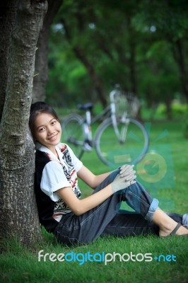 Portrait Of Young Woman With Blur Biclycle Background Relaxing I… Stock Photo