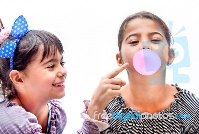 Portraits Of Beautiful Little Girls Blowing Bubbles Stock Photo