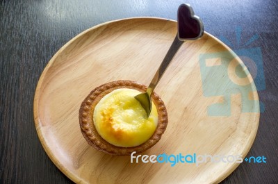 Portuguese Egg Tart On A Wood Dish Stock Photo