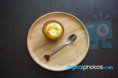 Portuguese Egg Tart On A Wood Dish Stock Photo