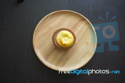 Portuguese Egg Tart On A Wood Dish Stock Photo