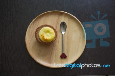 Portuguese Egg Tart On A Wood Dish Stock Photo