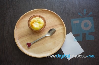 Portuguese Egg Tart On A Wood Dish With White Greeting  Blank Paper Stock Photo