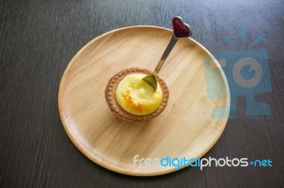 Portuguese Egg Tart On A Wood Dish With White Greeting  Blank Paper Stock Photo