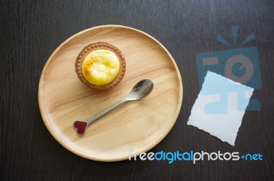 Portuguese Egg Tart On A Wood Dish With White Greeting  Blank Paper Stock Photo