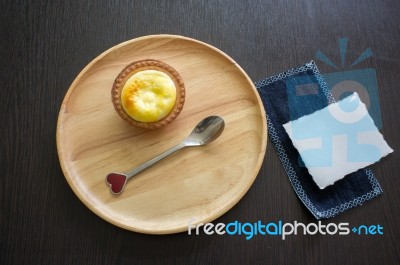 Portuguese Egg Tart On A Wood Dish With White Greeting  Blank Paper Stock Photo