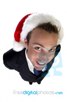 Posing Businessman With Christmas Cap Stock Photo