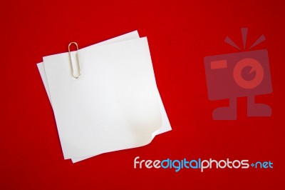 Post-it Notes With Clip On Red Background Stock Image