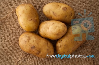 Potato Still Life On Sack Background Flat Lay Stock Photo