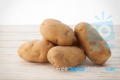 Potato Still Life On Wood Background Stock Photo