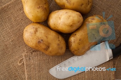 Potato Still Lift On Sack Background Stock Photo