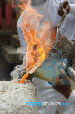 Pouring Liquid Metal Into Mold Stock Photo