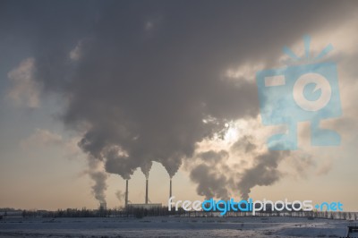 Power Plant Smoking In The Sky Stock Photo