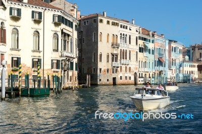 Powerboat Cruising Down The Grand Canal Stock Photo