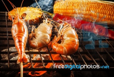 Prawn ,shrimp Grilled On Barbe-que Fire Stove With Pineapple ,red Chilly And Corn Stock Photo