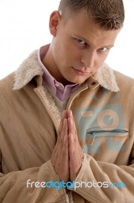 Praying Male Looking At Camera Stock Photo