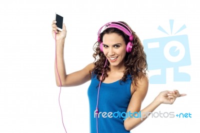 Preety Woman Listening To The Music From Smart Phone Stock Photo