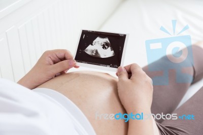 Pregnant Belly With Ultrasound Photo Stock Photo