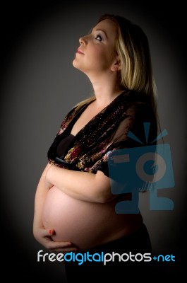 Pregnant Female Looking Up Stock Photo