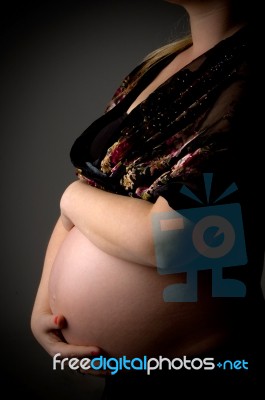 Pregnant Lady Holding Her Tummy Stock Photo