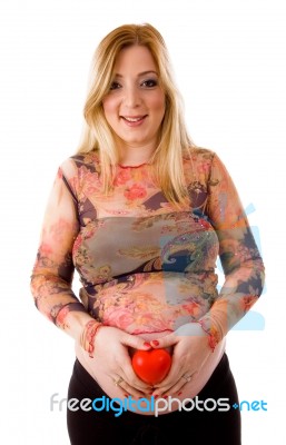 Pregnant Lady Keeping Heart Stock Photo