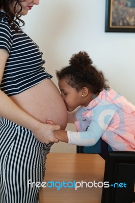 Pregnant Woman And Her Daughter Stock Photo