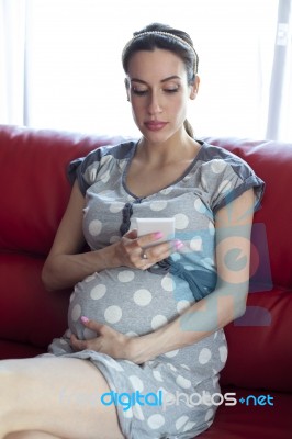 Pregnant Woman And Smart Phone Stock Photo