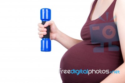 Pregnant Woman Exercising With Dumbbell Stock Photo