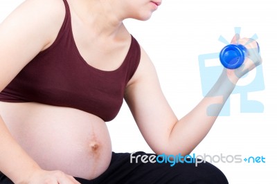 Pregnant Woman Exercising With Dumbbell Stock Photo