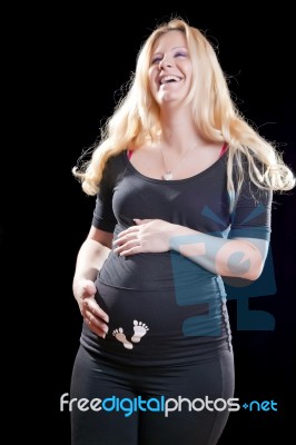 Pregnant Woman Holding Tummy Stock Photo