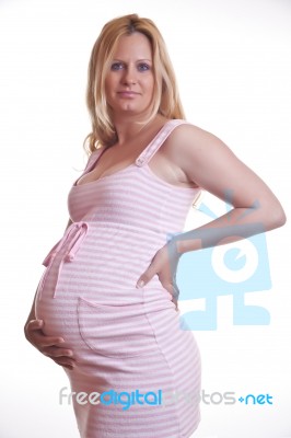 Pregnant Woman Holding Tummy Stock Photo