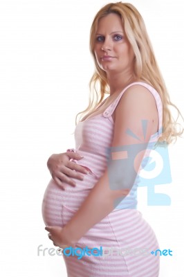 Pregnant Woman Holding Tummy Stock Photo