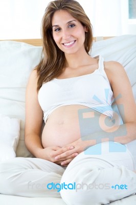 Pregnant Woman Relaxing At Home Stock Photo