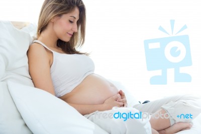 Pregnant Woman Relaxing At Home Stock Photo