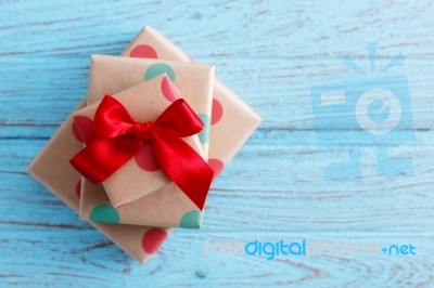 Present On Wood Background Stock Photo