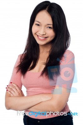 Pretty Asian Girl Posing Casually, Arms Folded Stock Photo