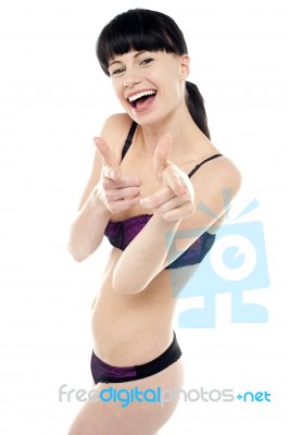 Pretty Brunette In Bikini Gesturing Gotcha Stock Photo