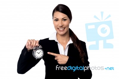 Pretty Business Woman Holding Alarm Clock Stock Photo