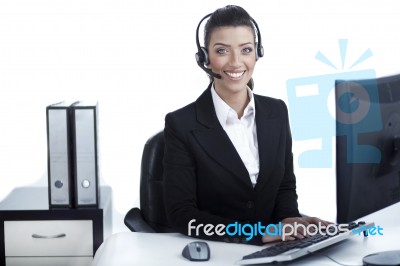 Pretty Business Woman Working At Office Wearing Headset Stock Photo