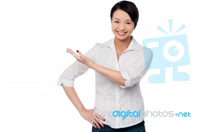 Pretty Casual Woman Directing The Way Stock Photo