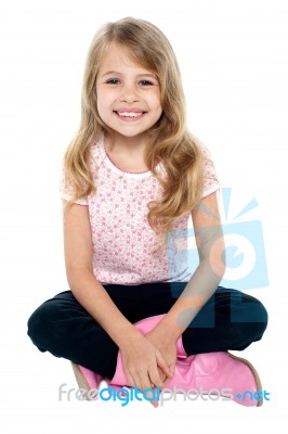 Pretty Caucasian Girl Seated On Floor Stock Photo