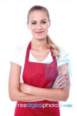 Pretty Chef Dressed In Red Apron Stock Photo