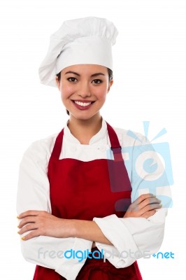 Pretty Chef Posing With Folded Arms Stock Photo