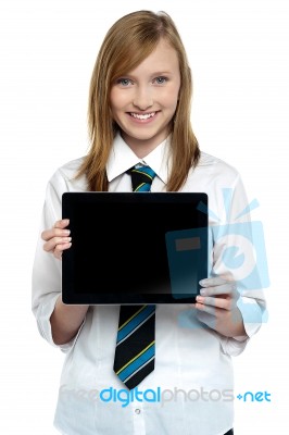 Pretty College Girl Displaying A Tablet Device Stock Photo