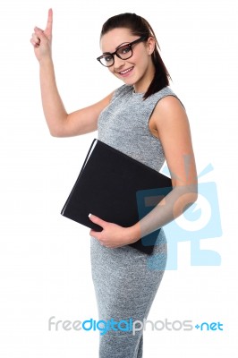 Pretty Employee Raising Her Arm Up Stock Photo