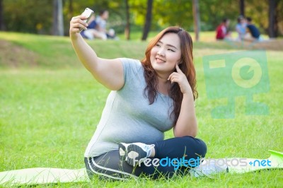 Pretty Fat Female Takes Travel Selfie Stock Photo