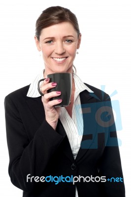 Pretty Female Manager Enjoying Her Coffee Stock Photo