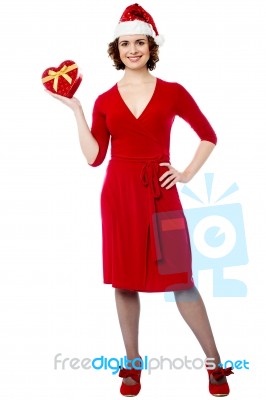 Pretty Female Santa With Xmas Gift Stock Photo