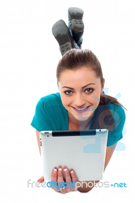 Pretty Girl Browsing On Her Tablet Pc Stock Photo