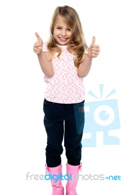 Pretty Girl In Trendy Wear Showing Double Thumbs Up Stock Photo